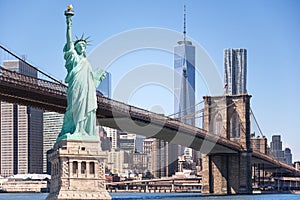 The statue of Liberty and Brooklyn Bridge with World Trade Center background, Landmarks of New York City