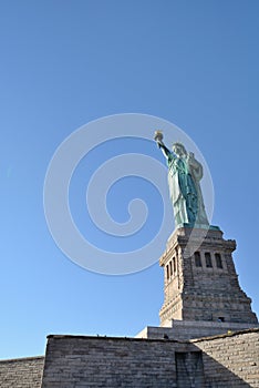 Statue of Liberty facing sun