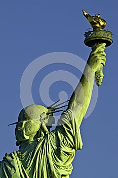 Statue of Liberty holding torch back view