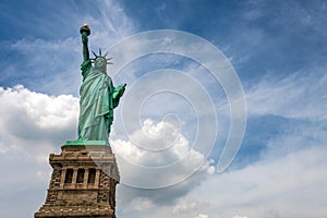 Statue of Liberty on Liberty Island closeup with blue sky in New York City Manhattan