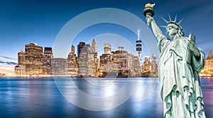 The Statue of Liberty with Lower Manhattan background in the evening