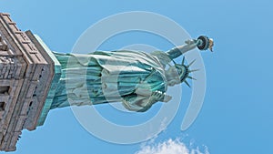 Statue of liberty monument with time lapse of cloud on summer sky in New York City, United states of America. USA travel concept