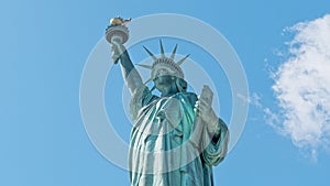 Statue of liberty monument with time lapse of cloud on summer sky in New York City, United states of America. USA travel landmark