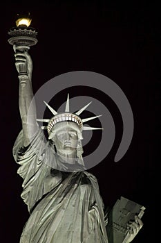 Statue of Liberty at night in New York Harbor USA.