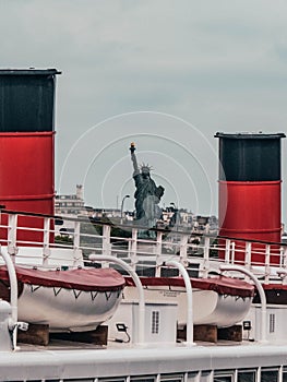 Statue of Liberty Paris, France seen between boat chimney