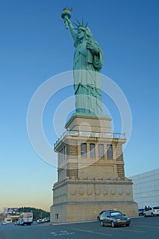 Statue of Liberty replica in front of a store.