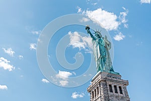 Statue of Liberty on sunny day, clear blue sky background. United States nation symbol, America travel destination concept