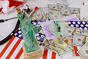 Statue Liberty in the tax period in the US with 1040 US tax form, money and calendar U.S dollars money