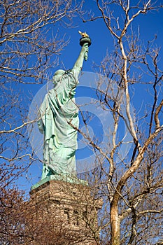 Statue of Liberty. Three quarter view from behind. New York City.