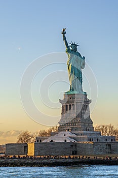 Statue of liberty vertical during sunset in New York City, NY,