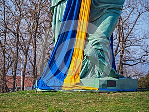 Statue of liberty wrapped with ukrainian flag photo