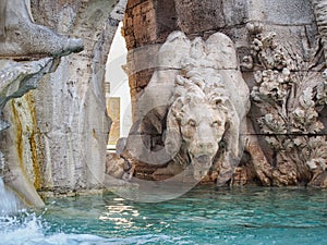 Statue of the lion on the Fountain of the Four Rivers Fontana dei Quattro Fiumi in the Piazza Navona in Rome, Italy.