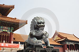 A statue of a lion-guard at Beijing Forbidden city - ancient res