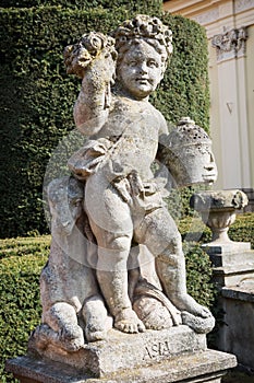 Statue of a little boy with one sheep