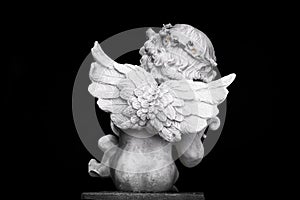 Statue of Little Cupid playing harp