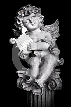 Statue of Little Cupid playing harp