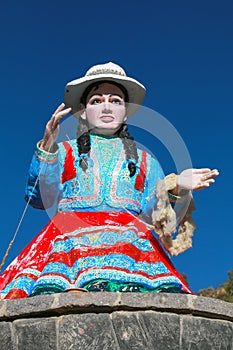 Statue of a local woman spinning wool in Chivay town, Peru