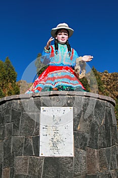 Statue of a local woman spinning wool in Chivay town, Peru