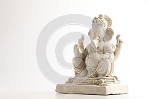 Statue of Lord Ganesha Made from plaster of Paris without color on white background