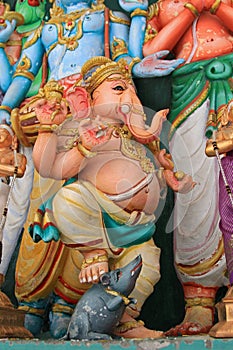 Statue of Lord Ganesha stepping on a mouse