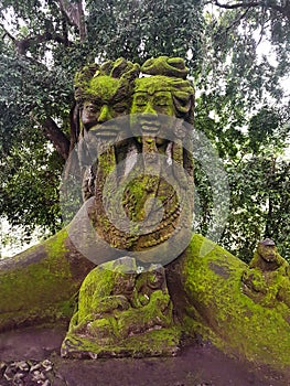 Statue of Lord Shiva influenced by Balinese mythology in Monkey Forest, Ubud, Bali, Indonesia photo