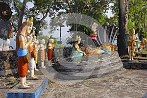 Statue of Lord Vishnu resting on Sheshnaag snake, with wife Lakshmi sitting and Lord Brahma, Nilkantheshwar Temple photo