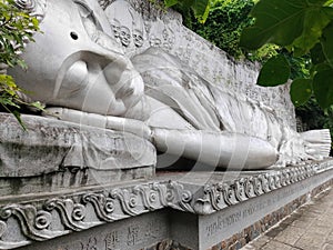 A statue of lying Buddha in a perspective projection