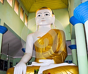 A statue made with real solid gold of gautama Buddha in a rural village for worshipers