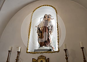 Statue of Madonna and child above the altar in a small church at Masseria Il Frantoio, Southern Italy