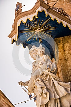 Statue of the Madonna with child on the corner of the Church of the Annunciation