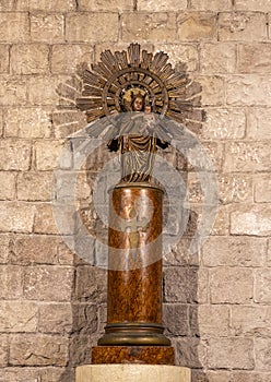 Statue of Madonna holding the infant Jesus inside the Basilica de Santa Maria del Mar in the Ribera district of Barcelona, Spain.