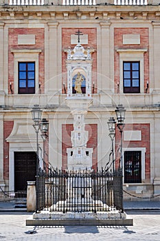 Statue of Madonna with infant at Archive Of The Indies Archivo General de Indias on Triumph Square, Seville, Spain photo