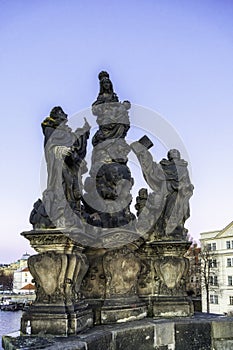 Statue of Madonna, St. Dominic and St. Thomas Aquinas on Charles Bridge in Prague