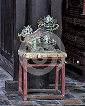 Statue of male Foo Dog inside the Hoa Kheim Palace, Tu Duc Royal Tomb, Hue, Vietnam