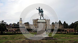 Statue of a man carrying a woman in a garden, England