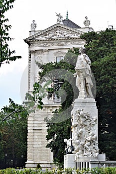 Statue of man, dedicated to Mozart, in the garden and park in the museum district in Vienna.