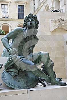 Statue man Louvre in Paris France