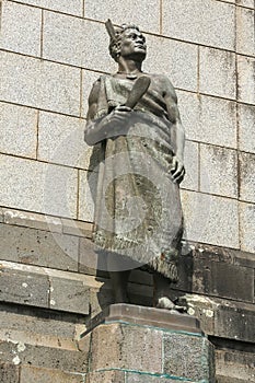 Statue of a Maori warrior. One Tree Hill, Auckland, New Zealand