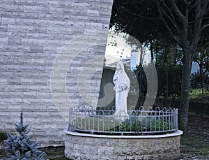 A statue of Maria in the courtyard of the church Pesaro, Italy