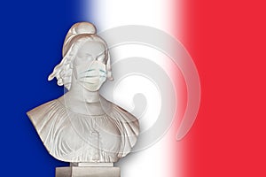 Statue of Marianne with a surgical mask, France republic symbol dealing with coronavirus covid-19
