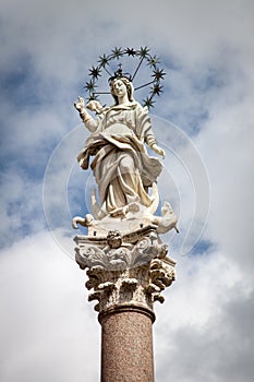 The statue of Mary, mother of Christ, with starry halo in Lucca, Italy