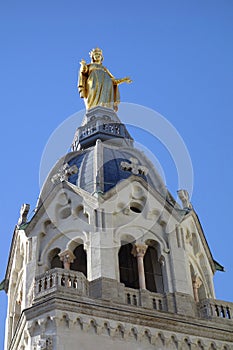 Statue of Mary on top of Chapel de la Vierge at Basilica of Notre Dame de Fourviere in Lyon, France