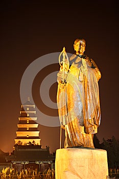 Statue of Master Xuan Zang in night photo