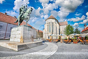 Statue of Michael the Brave and St Michael\'s Roman Catholic Cathedral in medieval fortress of Alba Iulia (Carolina