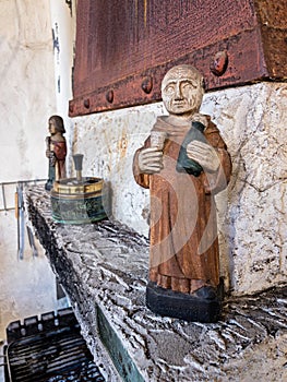Statue Of Monk With Champagne
