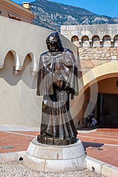 Statue of the monk in front of the Royal Palace in the State Mon photo