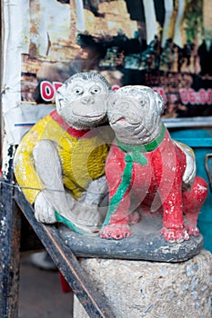 Statue of Monkey and Bulldog is on the street in Bangkok, Thailand. There are many sayings that mean monkey and dog belong togethe