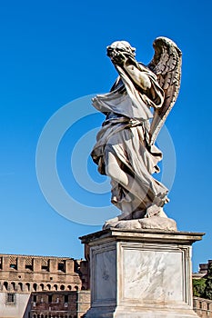 Statue of a monument to an angel on a background of blue sky