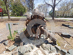 Statue of mother with children in Thorpe Park - Deephaven, MN USA. August 10,2019.