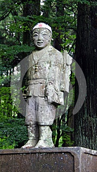 Statue of mountain climber pelgrim at Fuji shengen shrine